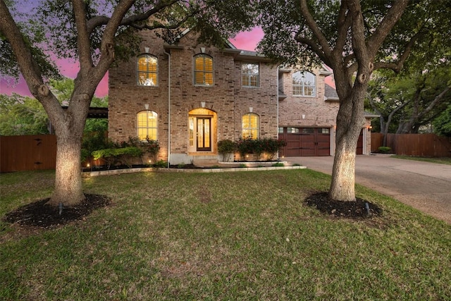 3109 Brigham Ct, Austin, TX 78732 - view of front facade featuring fence, a front yard, brick siding, concrete driveway, and an attached garage