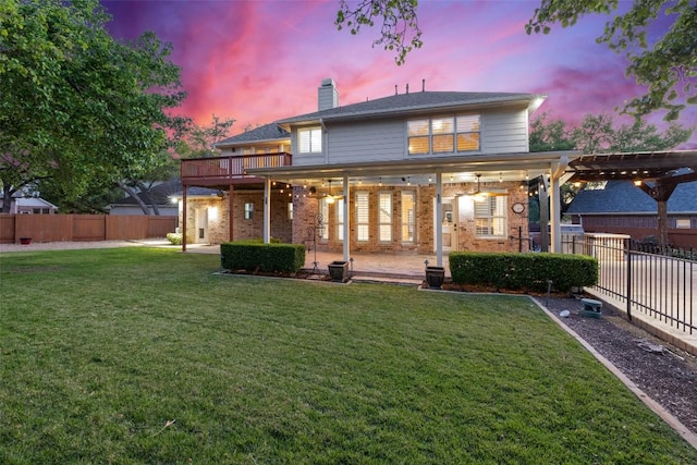 3109 Brigham Ct, Austin, TX 78732 - back of house at dusk with brick siding, a chimney, a fenced backyard, and a patio area