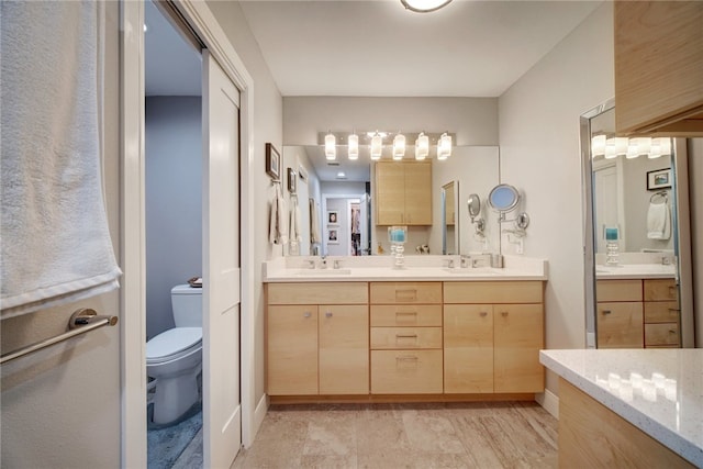 4411 Bilboa Dr, Austin, TX 78759 - bathroom featuring toilet and double vanity
