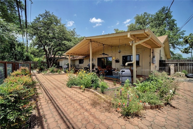 4411 Bilboa Dr, Austin, TX 78759 - rear view of house with a ceiling fan, a patio, and board and batten siding