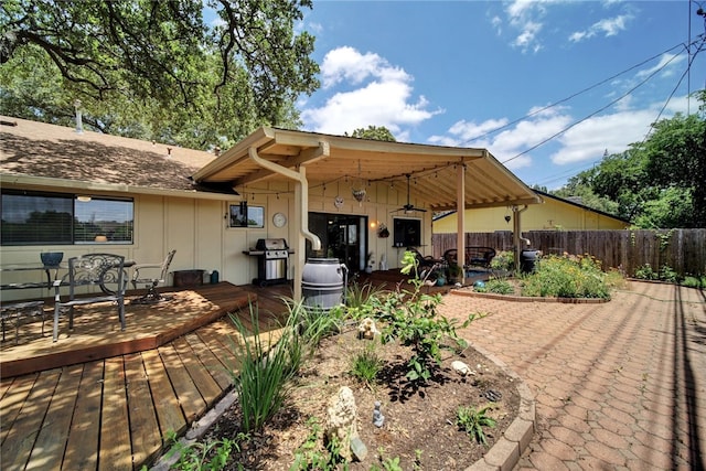 4411 Bilboa Dr, Austin, TX 78759 - back of house with board and batten siding, a deck, ceiling fan, and a patio