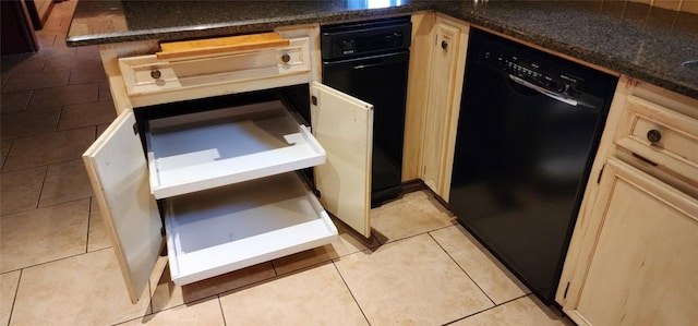 kitchen featuring black dishwasher, light tile patterned flooring, and light brown cabinetry