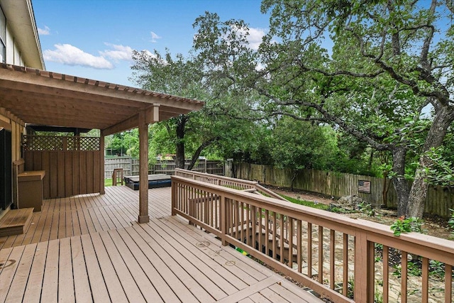 wooden deck with a fenced backyard