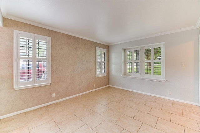 unfurnished room featuring crown molding, baseboards, and a wealth of natural light