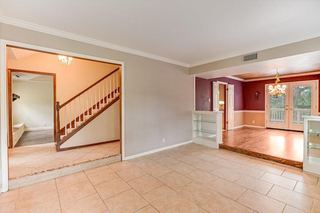 empty room featuring a notable chandelier, light tile patterned floors, visible vents, ornamental molding, and stairway