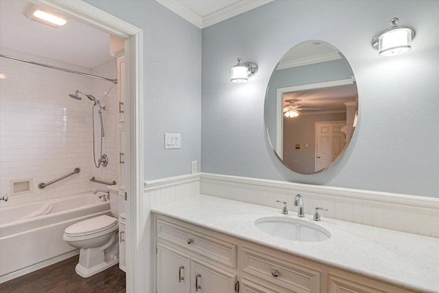 bathroom with crown molding, ceiling fan, toilet, and wood finished floors