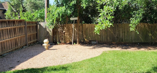 view of yard with a fenced backyard