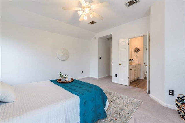 1500 Mexican Heather Ct, Pflugerville, TX 78660 - bedroom featuring light colored carpet, baseboards, vaulted ceiling, connected bathroom, and a ceiling fan