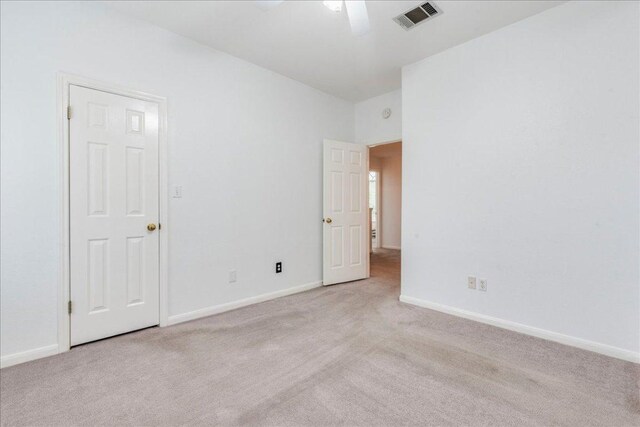 1500 Mexican Heather Ct, Pflugerville, TX 78660 - unfurnished bedroom with light carpet, baseboards, and ceiling fan