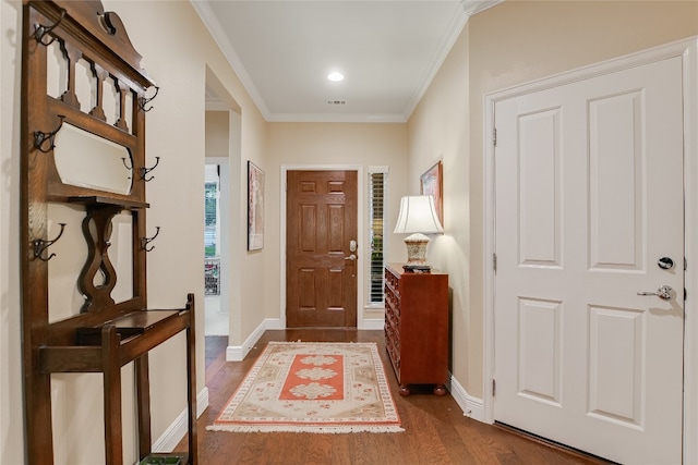 712 Independence Creek Ln, Georgetown, TX 78633 - entrance foyer featuring baseboards, visible vents, ornamental molding, and dark wood-type flooring