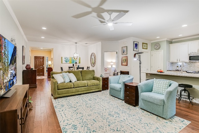 712 Independence Creek Ln, Georgetown, TX 78633 - living area featuring crown molding, wood-type flooring, and ceiling fan