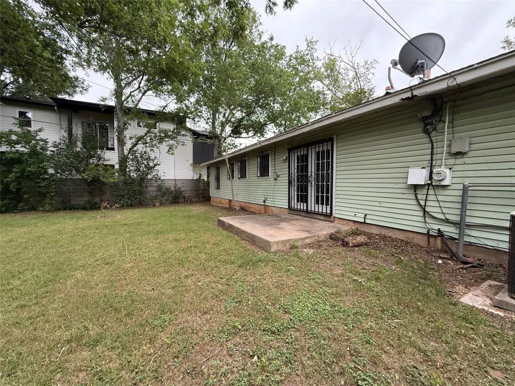 back of house with a lawn, fence, a patio area, and french doors