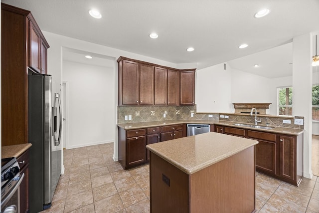 5929 Gunnison Turn Rd, Austin, TX 78738 - kitchen with a sink, stainless steel appliances, tasteful backsplash, a kitchen island, and a peninsula