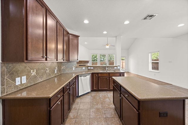 kitchen with visible vents, dishwasher, ceiling fan, a sink, and backsplash