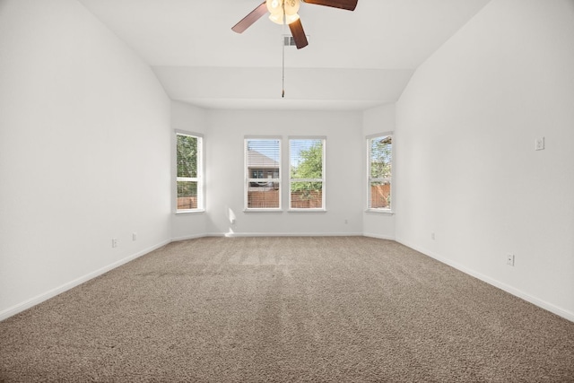 unfurnished room with light colored carpet, baseboards, ceiling fan, and lofted ceiling