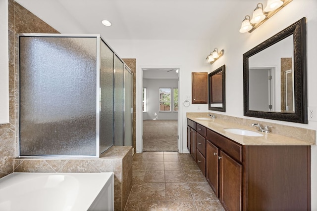 5929 Gunnison Turn Rd, Austin, TX 78738 - full bathroom with double vanity, a bath, a shower stall, and tile patterned floors