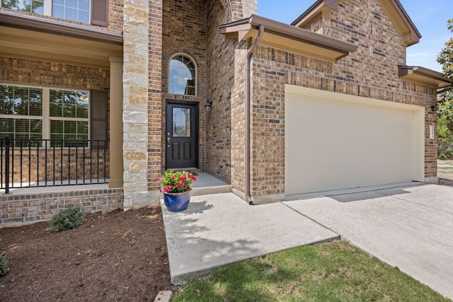 5929 Gunnison Turn Rd, Austin, TX 78738 - entrance to property with brick siding, a garage, and driveway