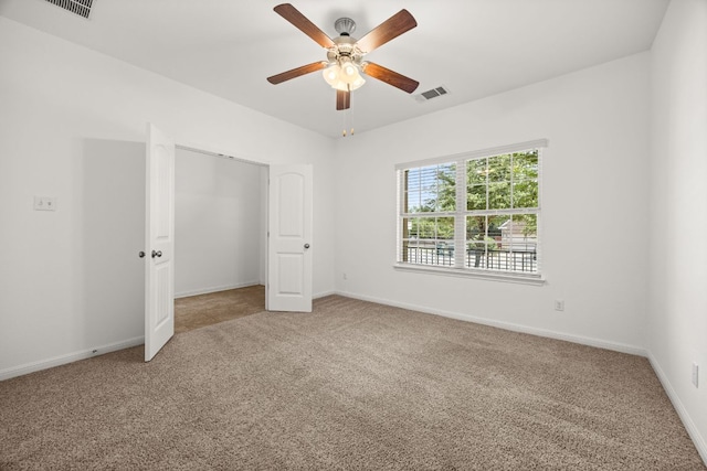 5929 Gunnison Turn Rd, Austin, TX 78738 - unfurnished bedroom featuring carpet, baseboards, a closet, and ceiling fan