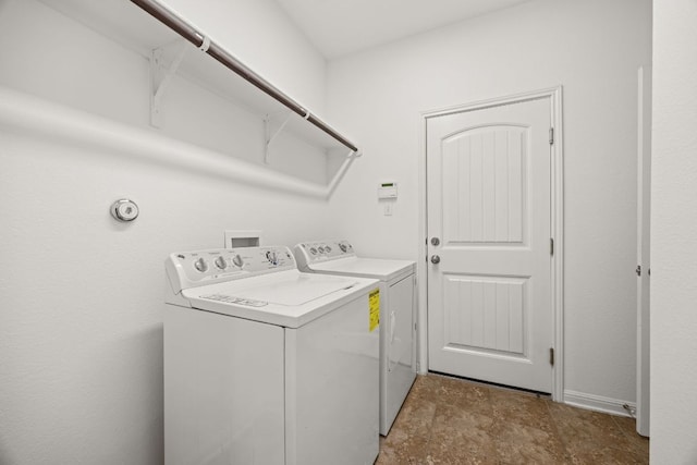laundry area with laundry area and separate washer and dryer