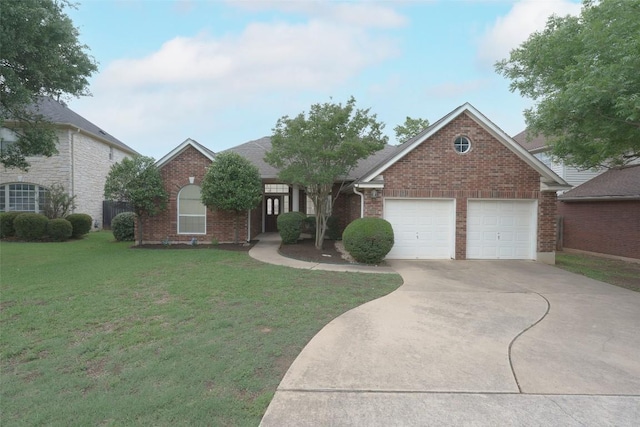 view of front facade featuring a garage, a front yard, driveway, and brick siding