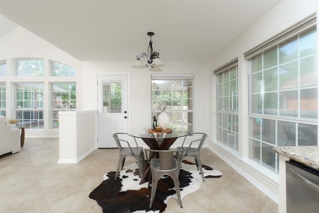 sunroom featuring an inviting chandelier
