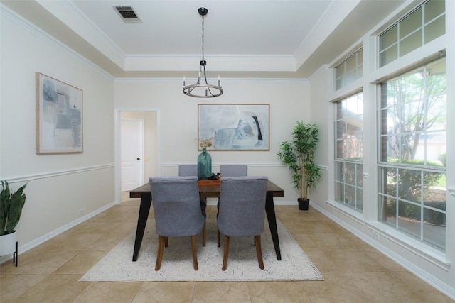 dining space with crown molding, a notable chandelier, light tile patterned floors, a tray ceiling, and visible vents