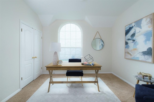 carpeted office with baseboards and lofted ceiling