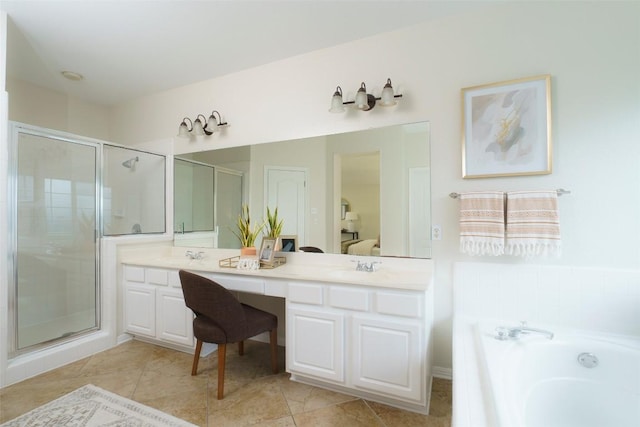 ensuite bathroom with double vanity, a stall shower, a garden tub, and connected bathroom