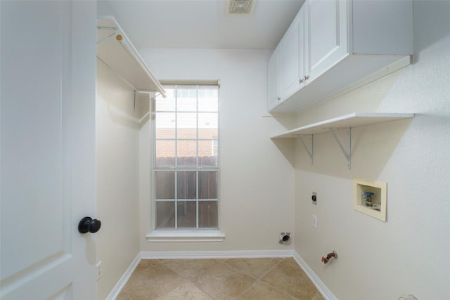 laundry area with cabinet space, washer hookup, baseboards, hookup for an electric dryer, and visible vents