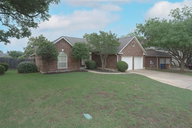 view of front of home with fence, an attached garage, a front lawn, brick siding, and concrete driveway