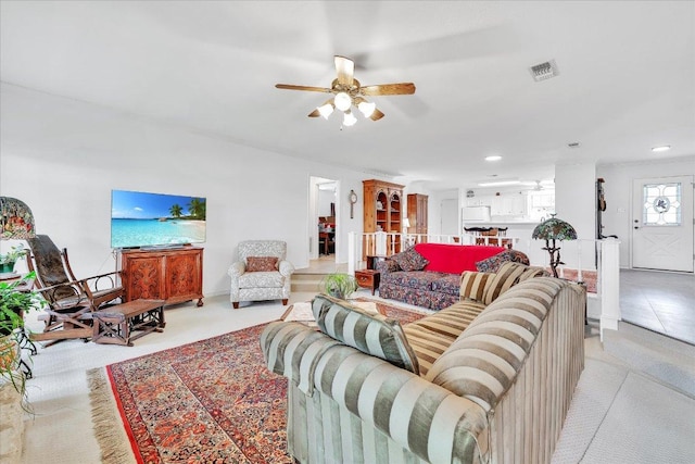 living area featuring visible vents, a ceiling fan, and recessed lighting