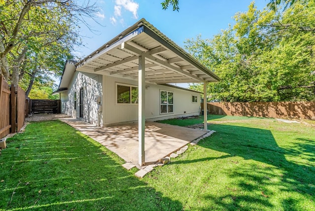 10429 Firethorn Ln, Austin, TX 78750 - rear view of property with a yard, a patio, and a fenced backyard