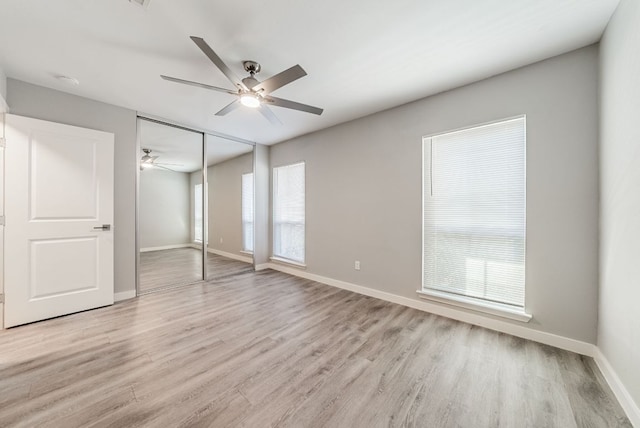 10429 Firethorn Ln, Austin, TX 78750 - unfurnished bedroom with baseboards, ceiling fan, a closet, and light wood-type flooring