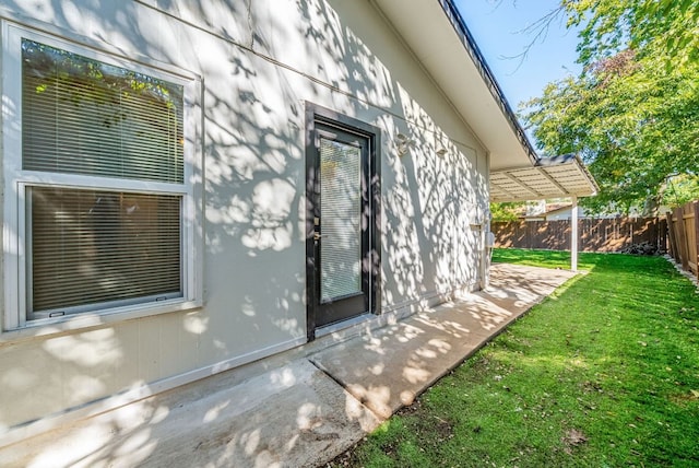 10429 Firethorn Ln, Austin, TX 78750 - view of side of home with a lawn, fence, and a patio area