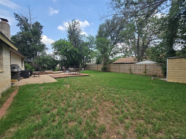 view of yard featuring a patio and a fenced backyard