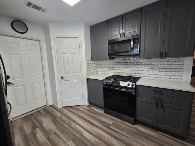 kitchen with visible vents, light countertops, appliances with stainless steel finishes, and gray cabinetry