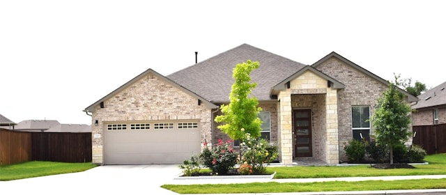 view of front of house featuring fence, an attached garage, a shingled roof, stone siding, and concrete driveway