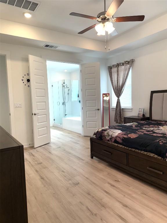 bedroom featuring recessed lighting, a ceiling fan, visible vents, and light wood finished floors