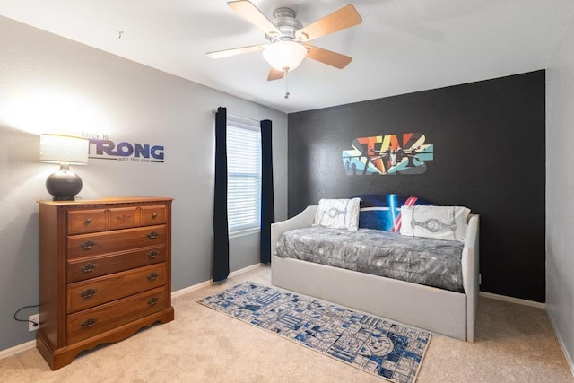 bedroom with baseboards, carpet flooring, and a ceiling fan