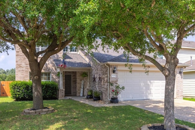 obstructed view of property featuring an attached garage, a front lawn, fence, and driveway