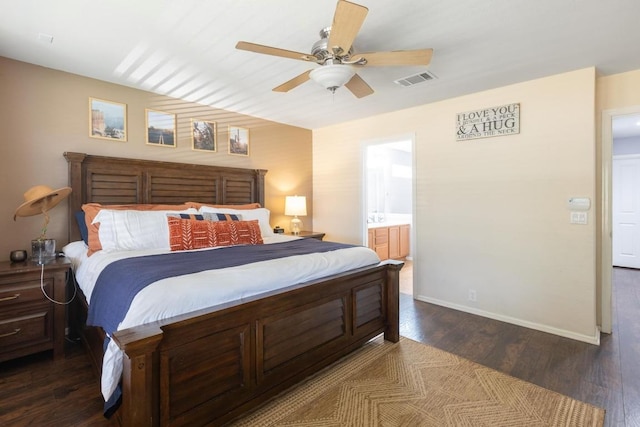 bedroom with a ceiling fan, visible vents, dark wood finished floors, baseboards, and ensuite bath