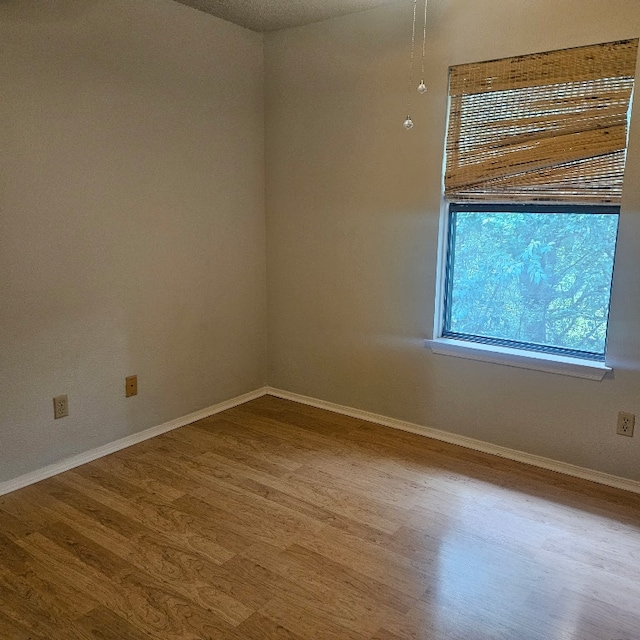 3012 Whisper Oaks Ln Unit I, Georgetown, TX 78628 - unfurnished room with wood finished floors and baseboards