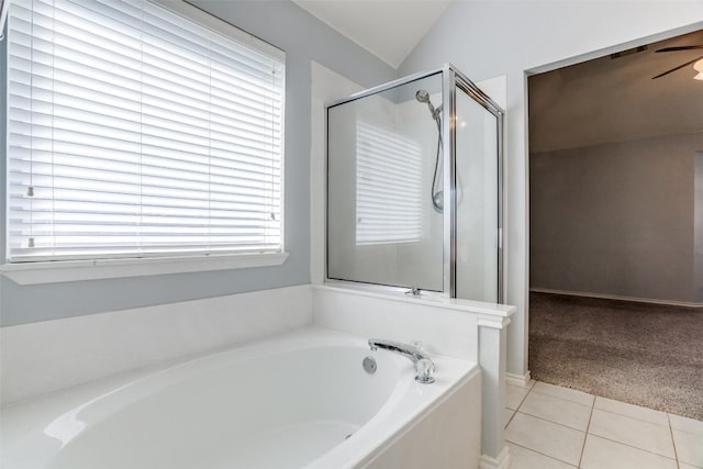 full bathroom with a garden tub, tile patterned floors, plenty of natural light, and a stall shower