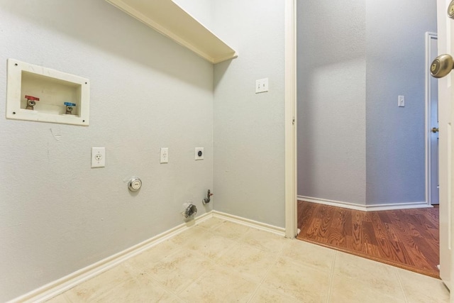 7418 W Magic Mountain Ln, Round Rock, TX 78681 - laundry area with baseboards, hookup for a washing machine, hookup for a gas dryer, and electric dryer hookup