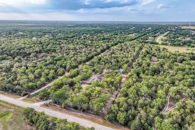 drone / aerial view with a view of trees