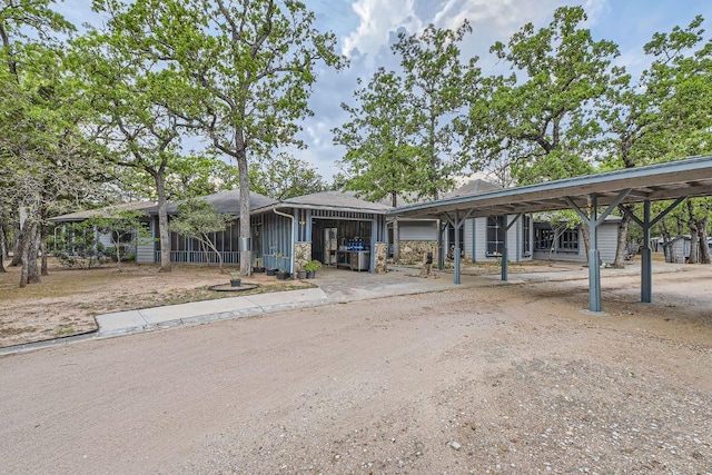 view of front of house with a detached carport
