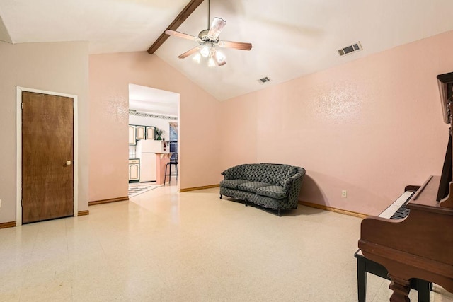 sitting room with visible vents, baseboards, ceiling fan, and vaulted ceiling with beams