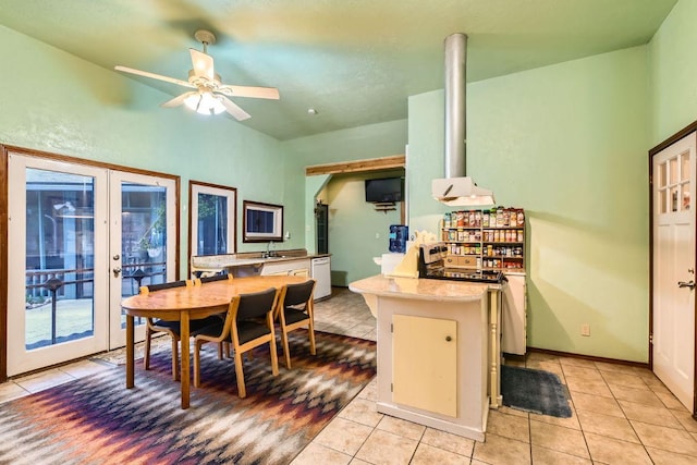 dining area with baseboards, light tile patterned floors, a ceiling fan, and french doors