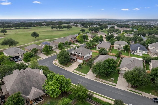 bird's eye view with view of golf course and a residential view
