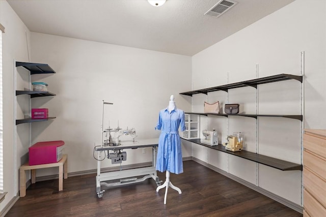misc room featuring visible vents and wood finished floors